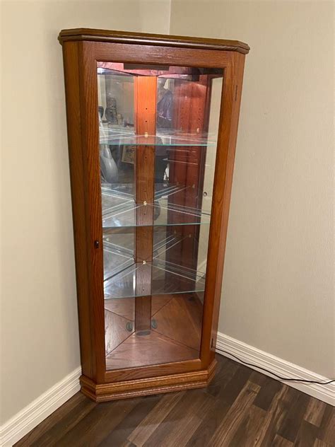 Corner Lighted Curio Oak Cabinet With Glass Shelves