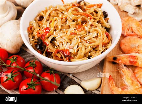 Chinese noodles wok with Ingredients on a table Stock Photo - Alamy