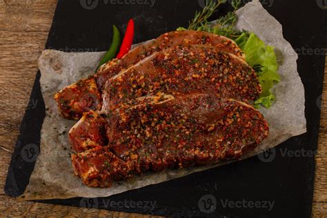 Raw marinated pork steak 11979887 Stock Photo at Vecteezy