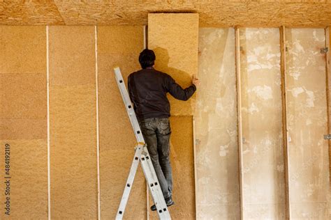 Installing thermal insulation inside a building, wood fiber boards Stock Photo | Adobe Stock