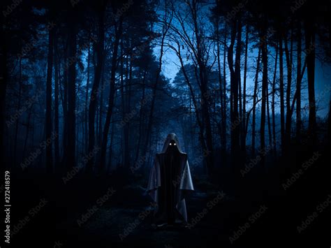 Ghost In A Dark Forest Spooky Horror Or Ufo Concept Stock Photo