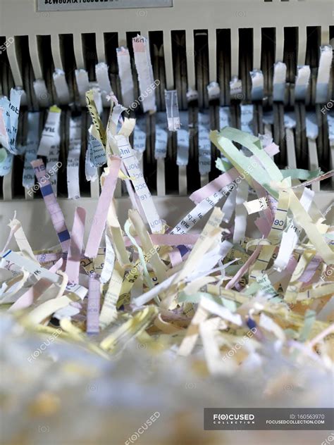 Shredded paper after passing through shredder. — privacy, destruction ...