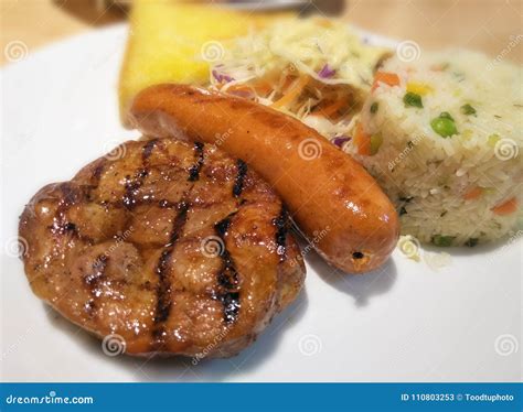 Close Up Barbecue Steak And Sausage On White Dish Stock Image Image