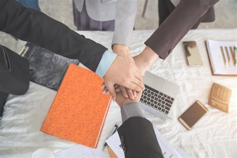 Premium Photo Cropped Hands Of Business People Stacking Hands