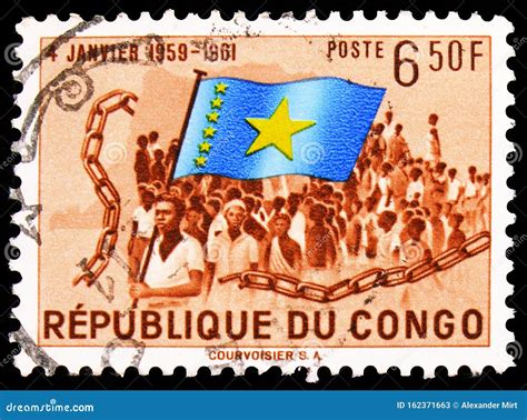 Postage Stamp Printed In Congo Shows Congolese With National Flag