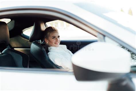 Beautiful Female Blonde Driver Behind The Wheel Of A White Car Stock Image Image Of Drive