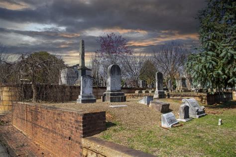 A Winter Landscape in the Graveyard with Headstones, Graves, Bare Trees ...