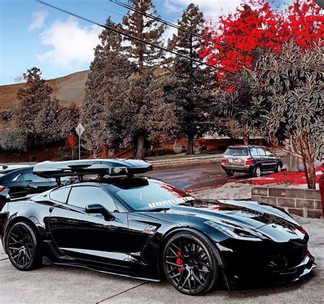 Chevrolet Corvette C7 | Black Sports Car with Surfboard