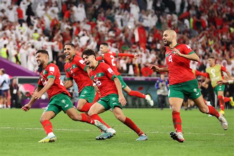 Morocco Players Celebrate With Former Ajax And Netherlands Star