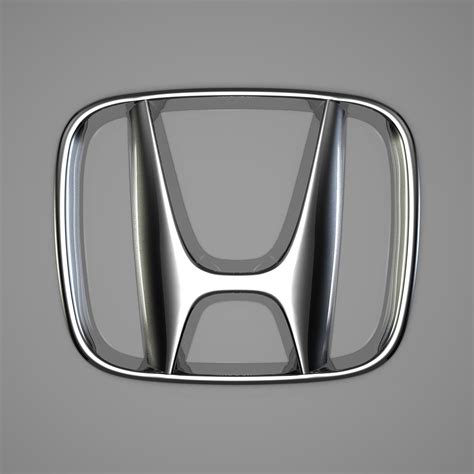 The Front View Of An Automobile Emblem On A Gray Background With No