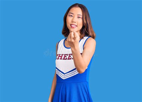 Young Beautiful Chinese Girl Wearing Cheerleader Uniform Beckoning Come