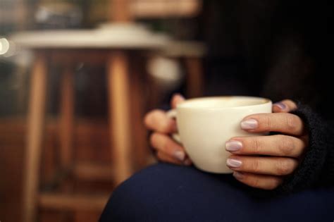 Premium Photo Female Hand Hold Hot Coffee Cup