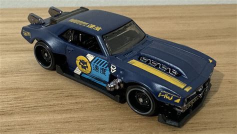 Машинка Базова Hot Wheels Custom Camaro Slammed HKG Blue купити в інтернет магазині