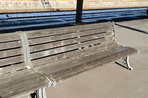 Wooden Bench Waiting Chair For The Train At The Railway Station