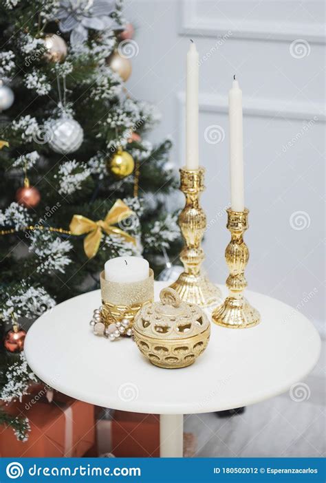 New Year Decorations On The Table Candles In Gold Candlesticks A Box