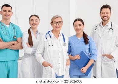 Portrait Medical Doctors Wearing Uniforms Indoors Stock Photo 2242026303 | Shutterstock