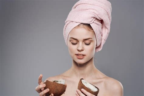 Premium Photo Woman With Towel On Head Naked Shoulders Coconut In