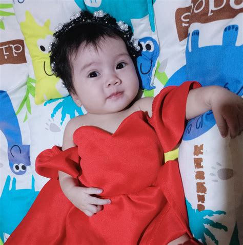 arti nama bayi thania