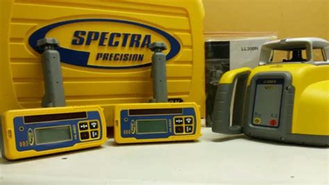 TRIMBLE SPECTRA PRECISION LL300N niveau avec 2 RÉCEPTEUR HL450 EUR 1