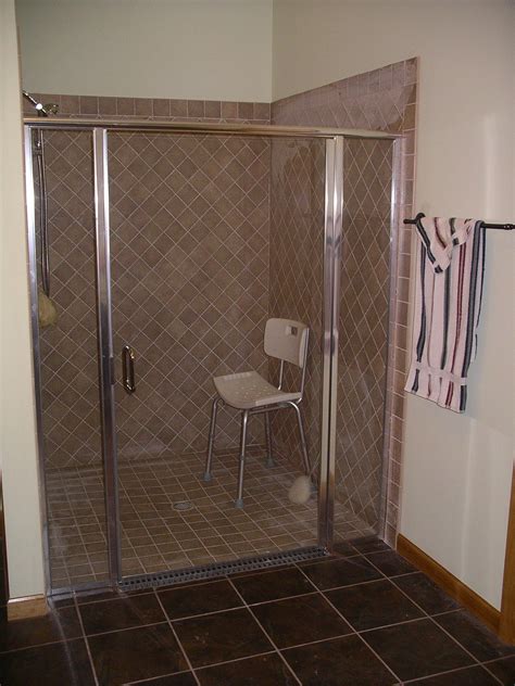 Handicap Accessible Tile Shower With Glass Doors Completed By Gildehaus Construction