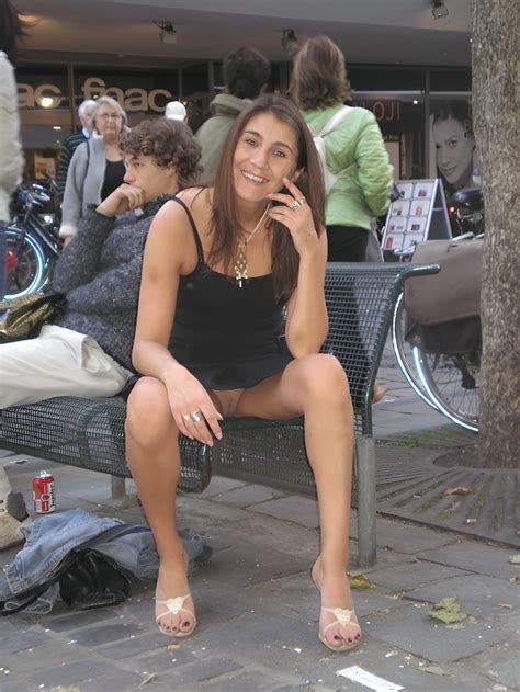 In A Park In A Short Dress And Showing Her Pussy And Long Legs