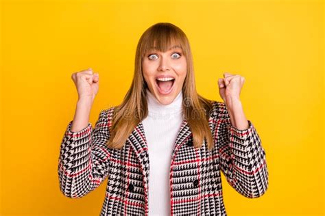 Portrait Of Astonished Positive Lady Fists Up Open Mouth Celebrate