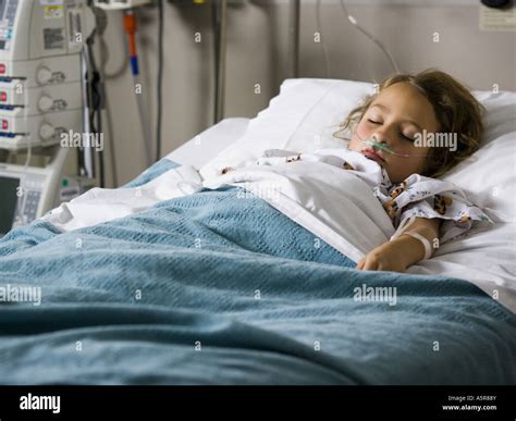 Young girl in hospital bed with respirator Stock Photo - Alamy