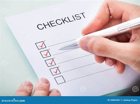 Person S Hand Marking On Checklist With Pen Stock Image Image Of