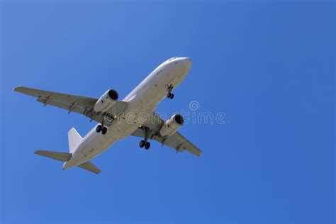 Passenger Airplane Taking Off Into The Blue Sky Stock Image Image Of