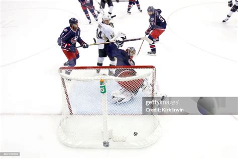 Chris Kunitz Of The Pittsburgh Penguins Watches As A Shot From Evgeni