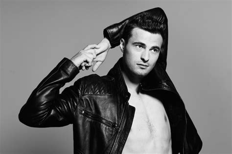 Premium Photo Sexy Man In A Leather Jacket With A Naked Torso