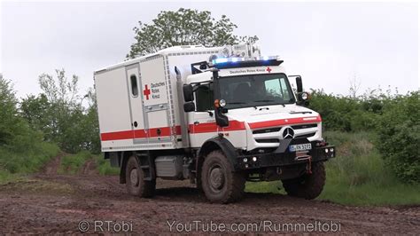 German Red Cross Mercedes Unimog Ambulance Off Road Driving With Blue