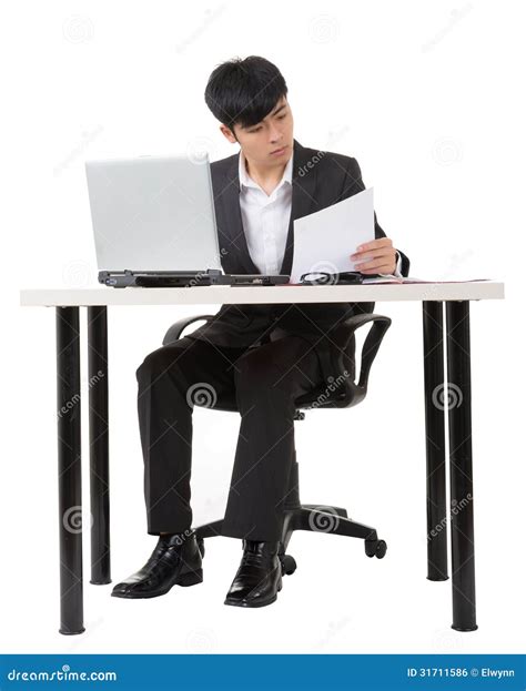 Businessman Work Using The Computer Calculating Invoice In Office