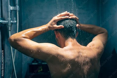 Man Taking A Shower Washing Hair With Shampoo Product Under Water