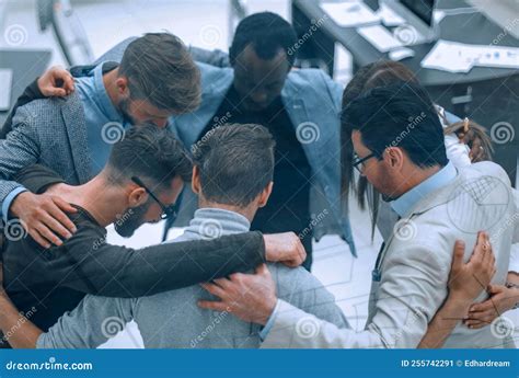 Group Of Successful Business People Hugging Each Other Stock Image