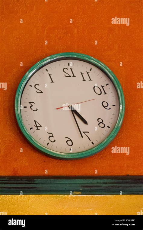 Backwards Wall Clock Runs Counterclockwise And Reverse Stock Photo Alamy