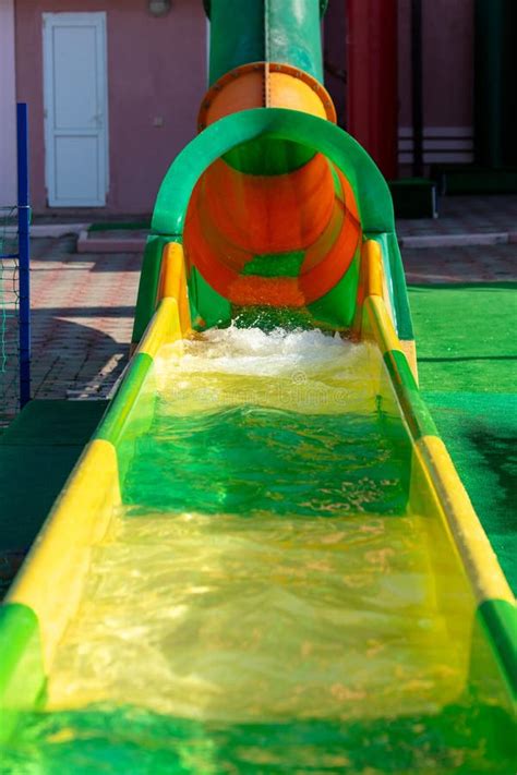 Yellow Green Slide In The Pool Of The Water Park Stock Image Image Of