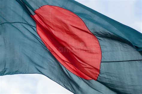 Bangladeshi Flag With Large Red Circle Flying At Full Mast Stock Photo