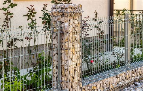 Steel grating fence made with wire with gabions Stock Photo | Adobe Stock