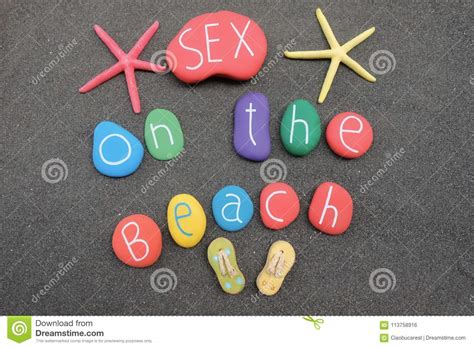 Sex On The Beach Cocktail Name With Multicolored Stones Over Black Volcanic Sand Stock Photo