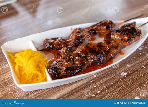 popular filipino food pork barbeque  papaya atchara stock image