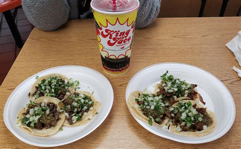 A classic: carne asada and al pastor (both with green salsa) from the