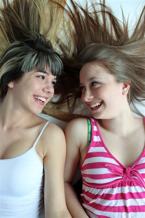 Two Smiling Teen Girls Having Fun Together Stock Photo Image Of Blonde Happy 24334120