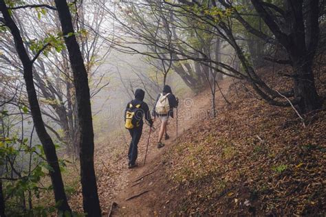 Two Man Friends With Backpack Hiking Together In Autumn Nature Stock