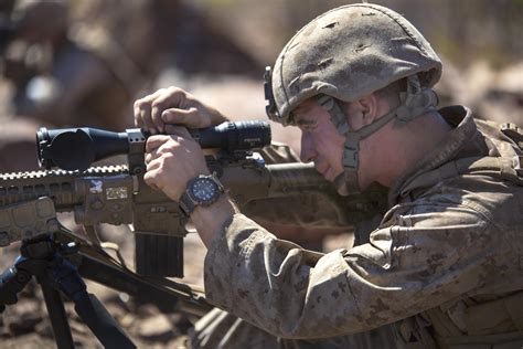 U S Marine Corps Sgt Tyler J Fox Adjusts His M110 Semi Automatic Sniper System S Wind And