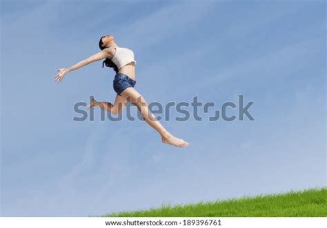 Excited Woman Jumping Highly On Nature Stock Photo 189396761 Shutterstock