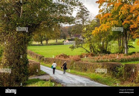 Women Walking Along A Road Section Of Offas Dyke Path Forming Part Of