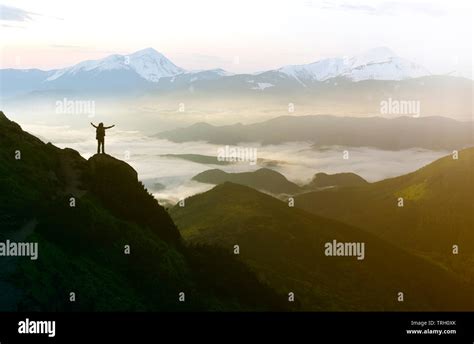 Wide Mountain Panorama Small Silhouette Of Tourist With Backpack On