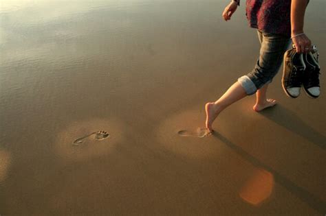 Premium Photo Low Section Of Woman Walking In Water