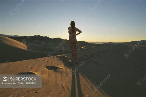 Naked Female Posing On The Sand Dunes SuperStock